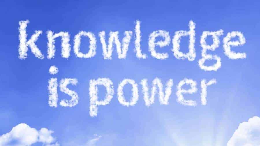 A bright blue sky with the message "knowledge is power" spelled out in white, fluffy clouds.