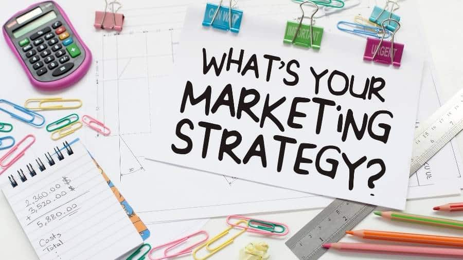 A piece of paper with the message "What's Your Marketing Strategy?"